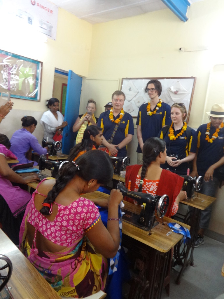 rotary tour guest in tailoring class