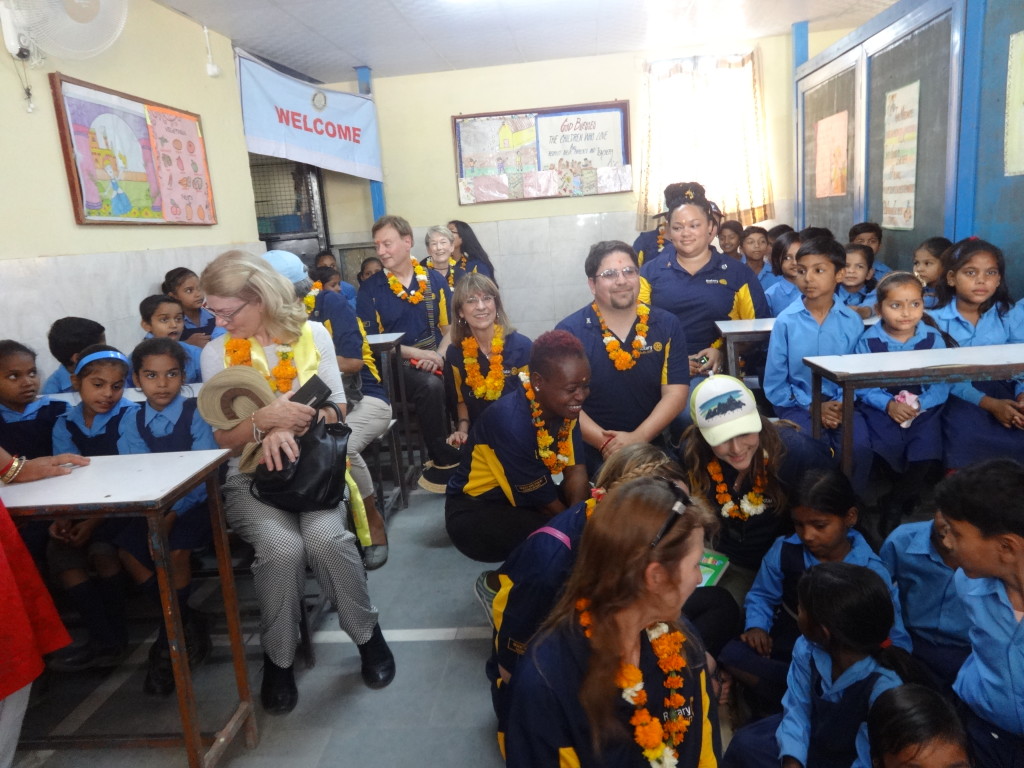 rotary tour guests with children