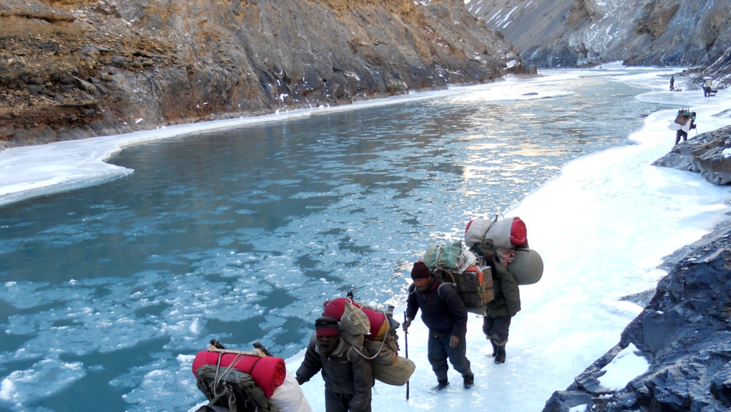 Sherpa and trekkers Zanskar Valley