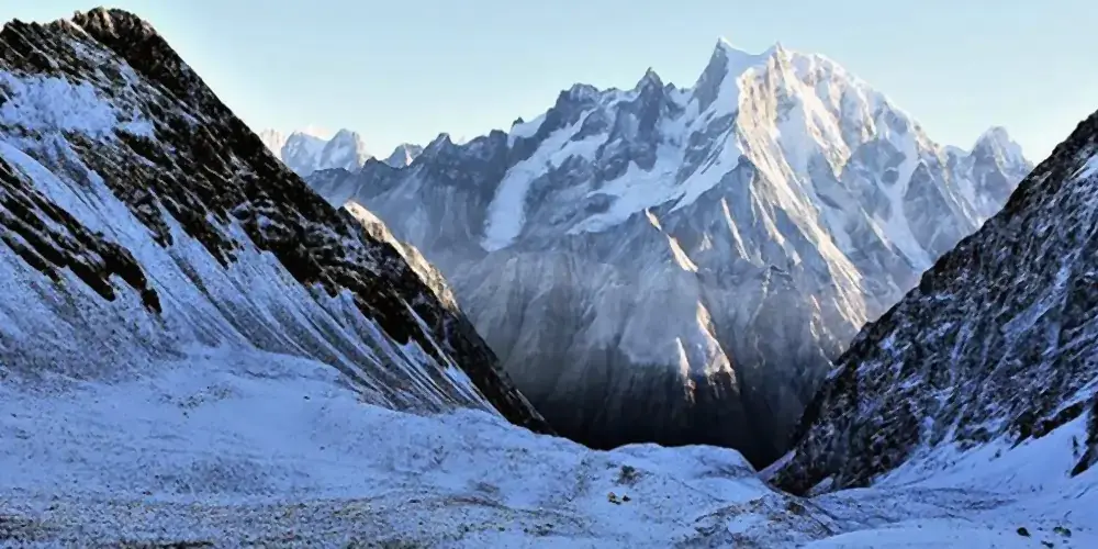 Mountaineers trekking toward Black Peak summit through snowy glacier terrain in Uttarakhand during Black Peak Trek 2026 expedition.