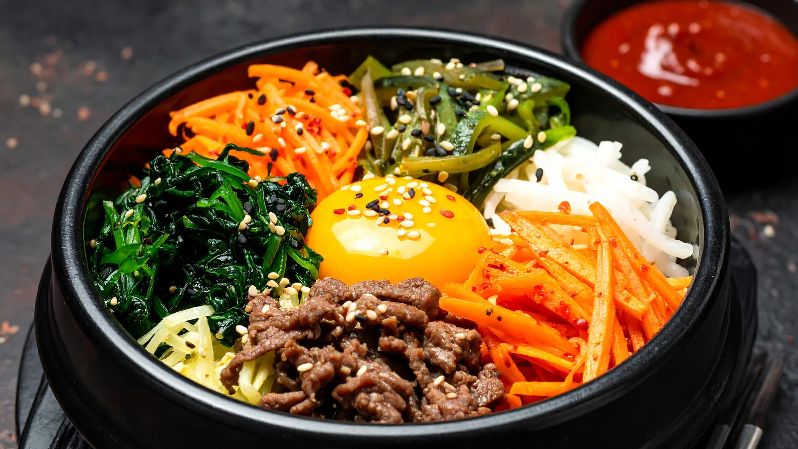 South Korea Food: Traditional South Korean food featuring bibimbap, kimchi, Korean side dishes and authentic Korean cuisine.